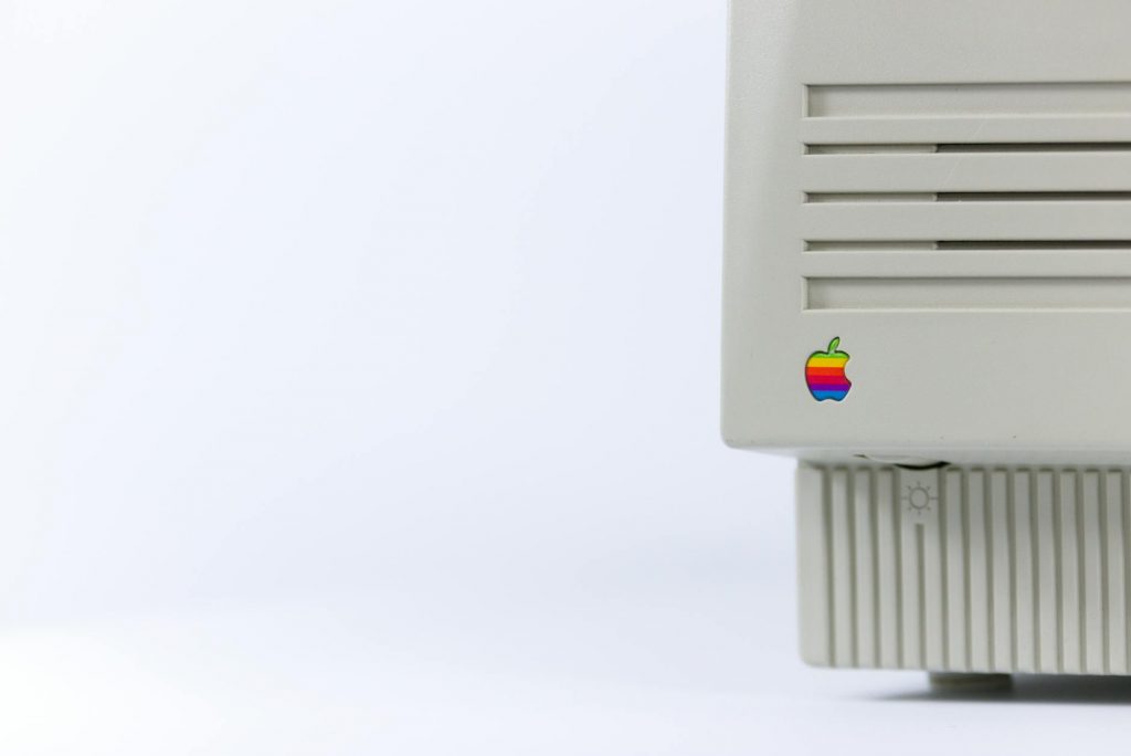 gray device with apple logo on white surface