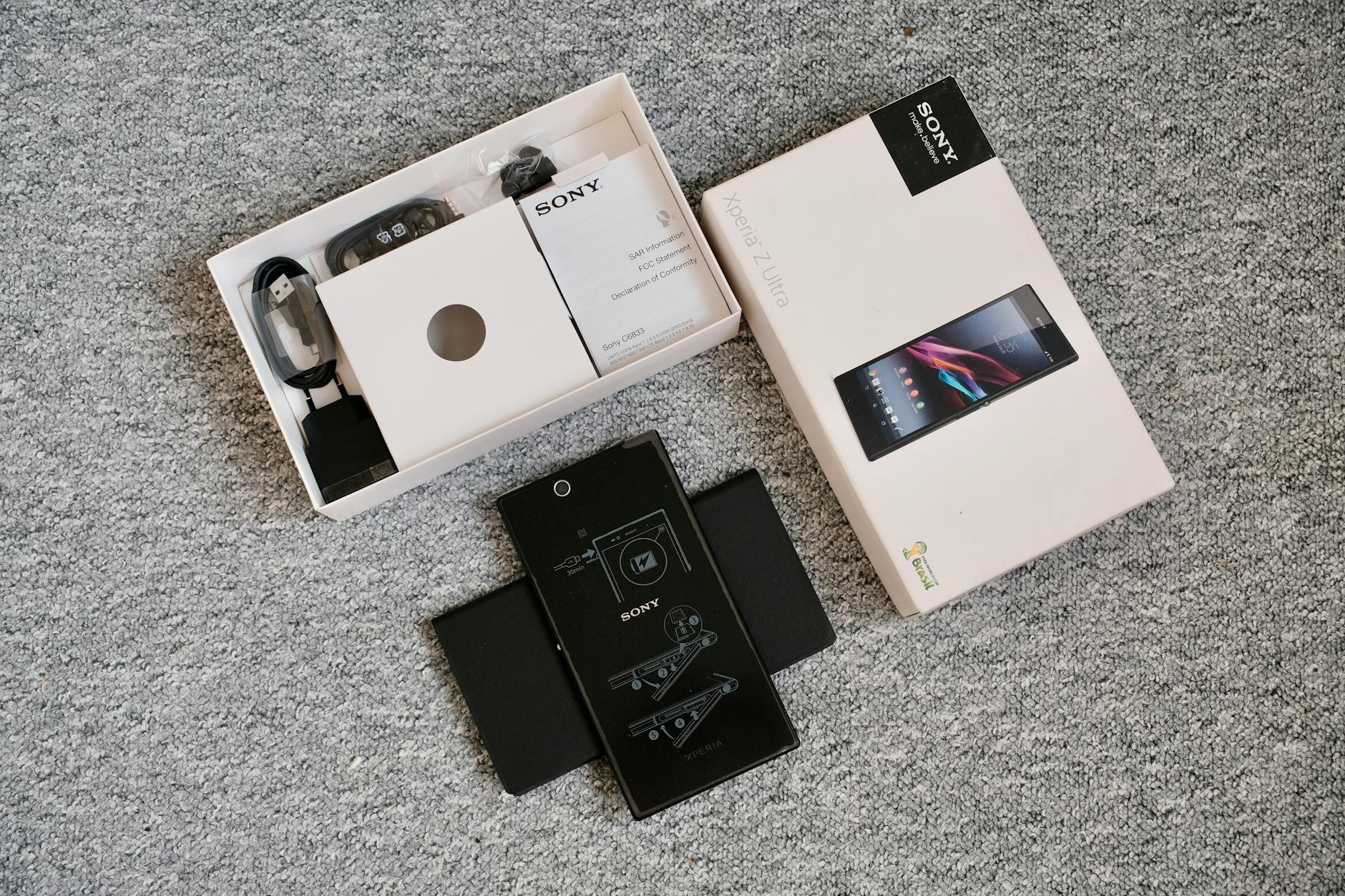 unboxing of a mobile phone with accessories